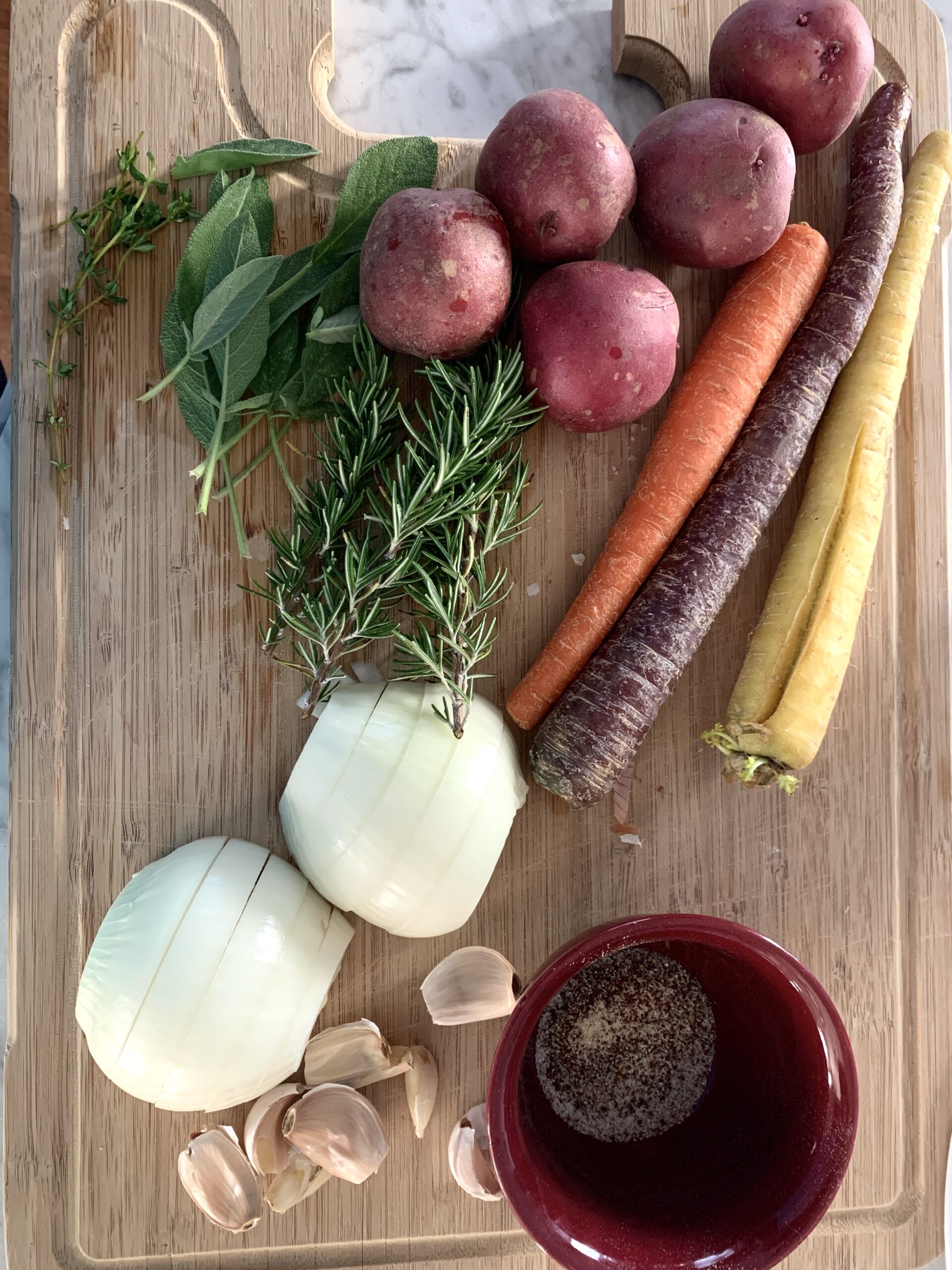 cutting board of vegetables and herbs