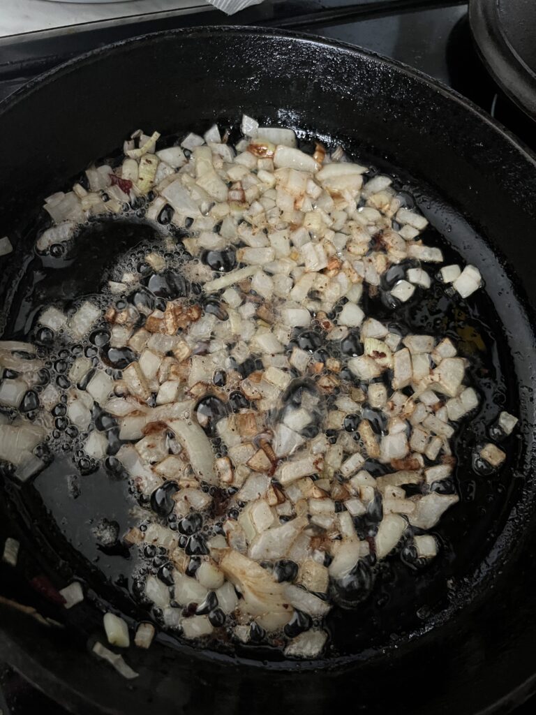 cast iron pan of diced onions